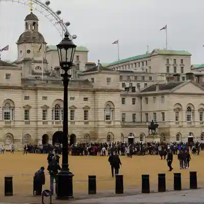 The clock tower and buildings with the London Eye in the background.