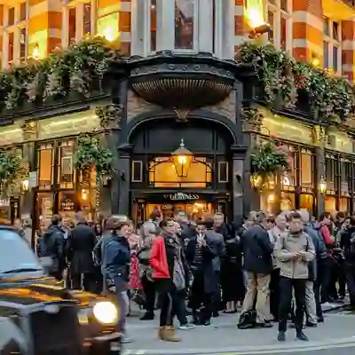 Customers outside a pub with London Black Taxi.