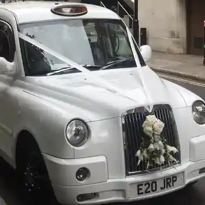 White London Cab with wedding ribbons.