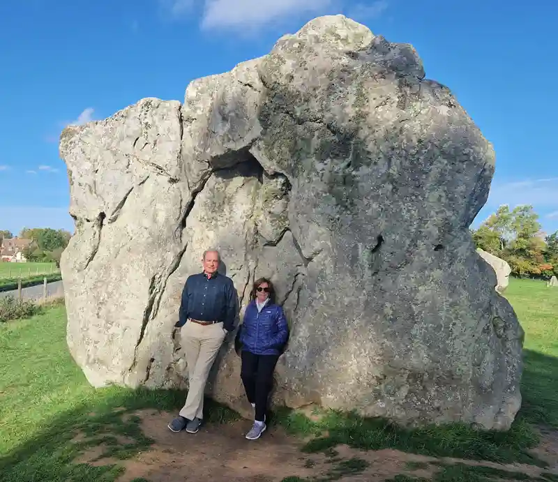 Avebury Tour guests by the huge Devil's Stone.