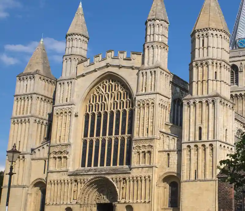 Romanesque (Norman) with Gothic stone=built facade.