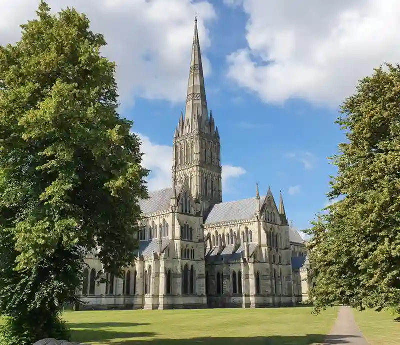Gothic style exterior with trees on bright sunny day.