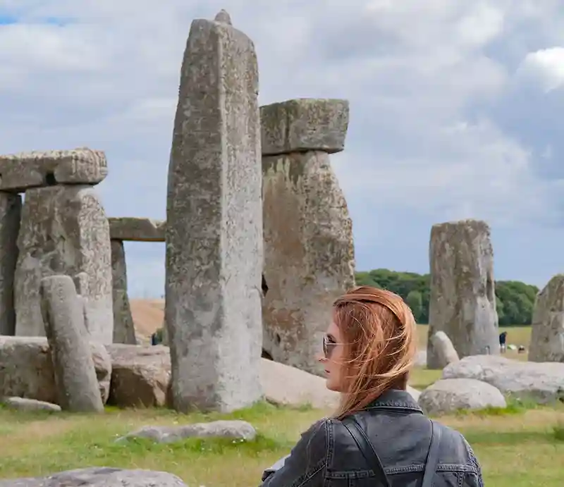 Stonehenge Guest in front of the stones.
