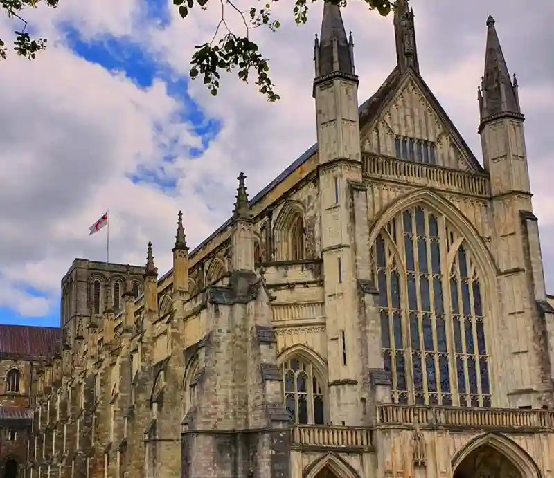 Massive central tower and a blend of Norman and Gothic architecture.