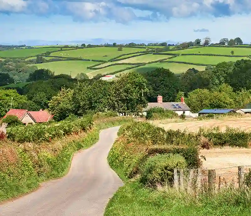 Devon Country road, farm and fields.