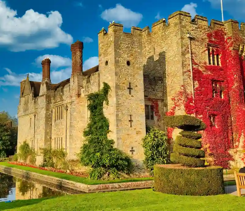 Exterior with red creeper covering side wall.