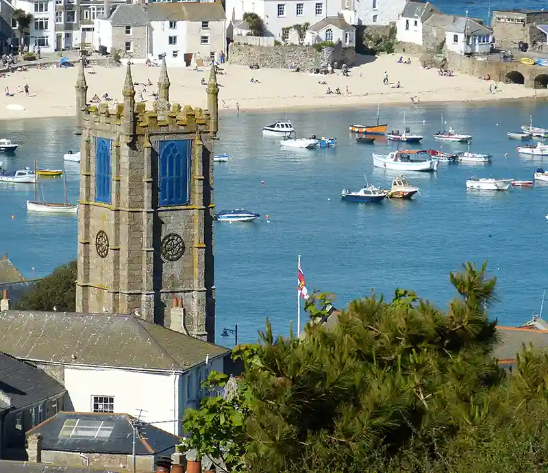 St Ives The church with beach and sea beyond.