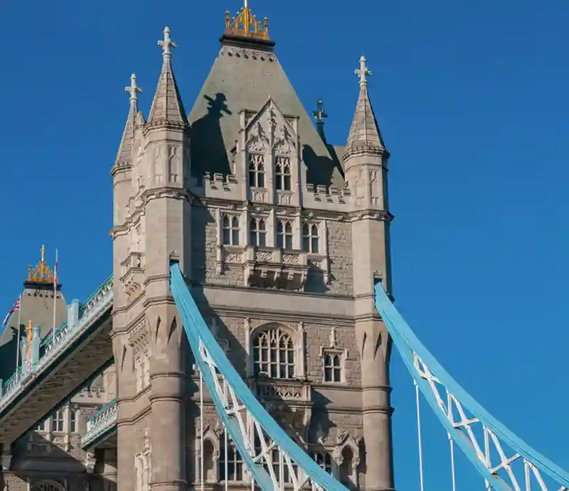 The Gothic style tower with blue sky.