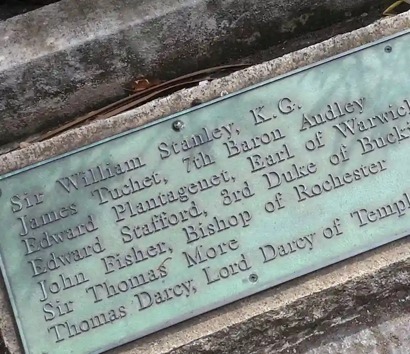 Green patina plaque displaying names of dignitaries.