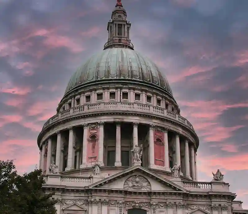 St Paul The dome against a pink evening sky.