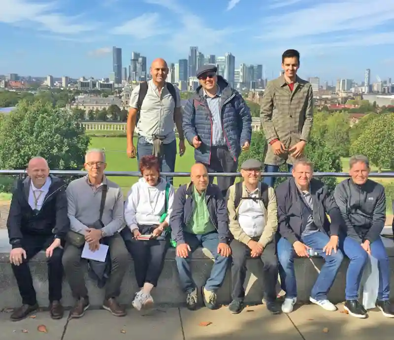 Rob and guests Posing with park and Canary Wharf in the background.