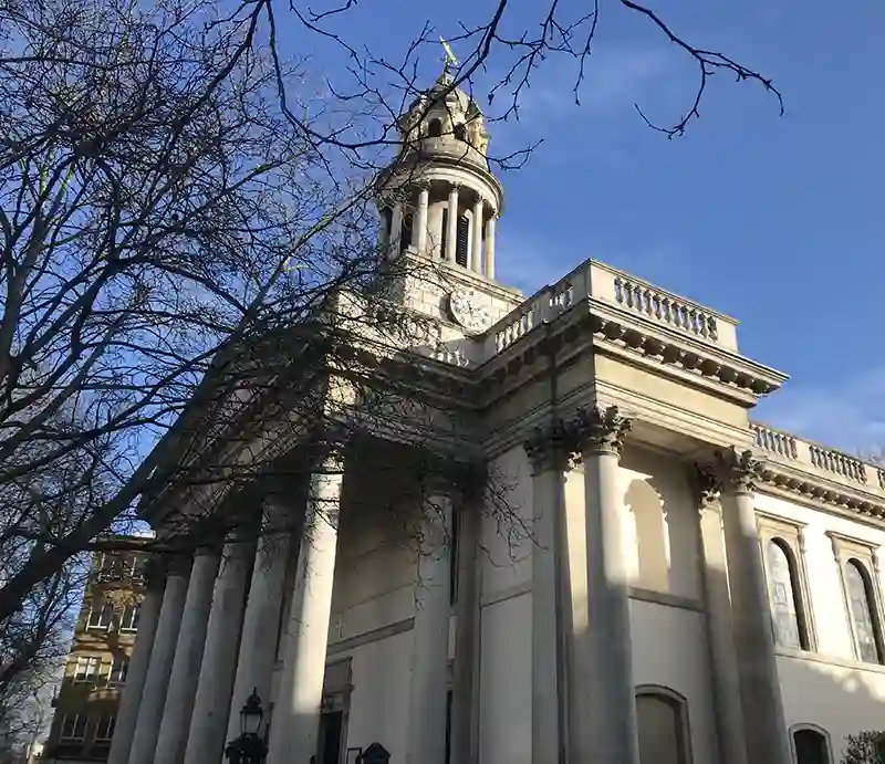 St Marylebone Church Massive stone columns of the exterior with clock tower.