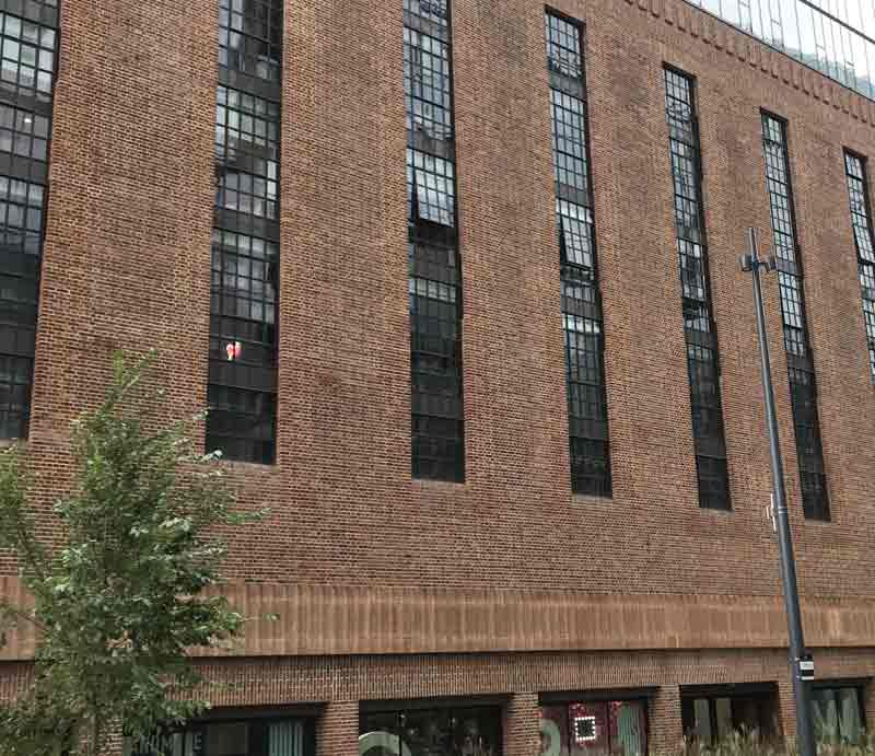 Brick built walls and windows designed in the art deco style.
