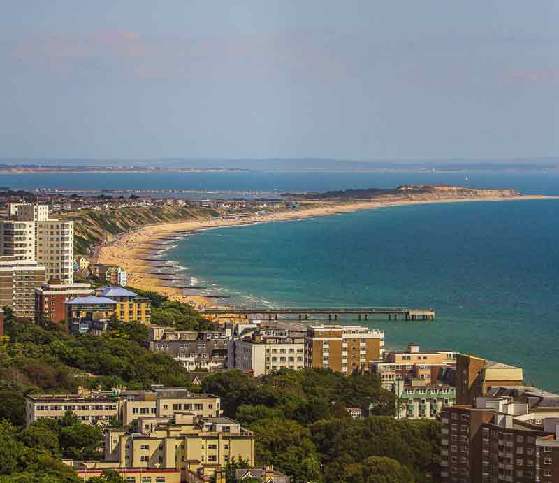Bourmemouth Aerial view of coastline with sea, beach and hotels.