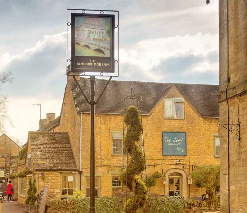 Kingsbridge Inn & Croft Restaurant Exterior of the buildings, pub sign and garden.
