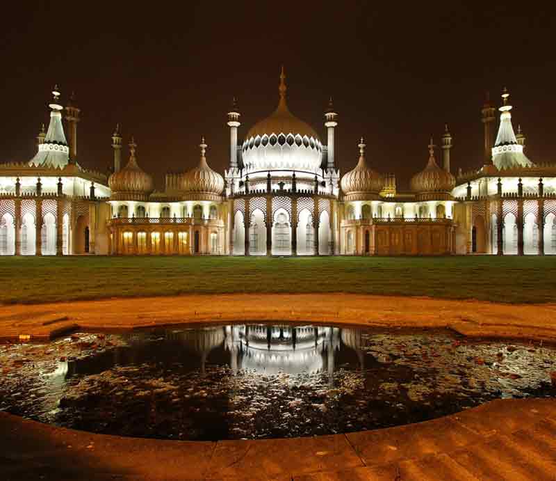 Brighton Royal Pavilion The palace lit up at night.