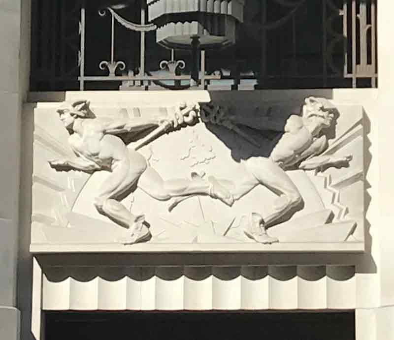 Art Deco styled carving of Mercury over entrance.