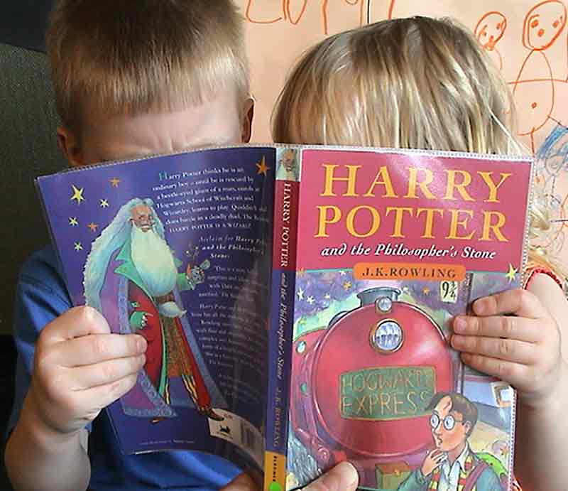 Harry Potter Tour Book being read by children Harvey & Maisie Wilkie.