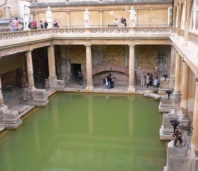 Roman Baths Classical architecture of columns surrounding the pool.