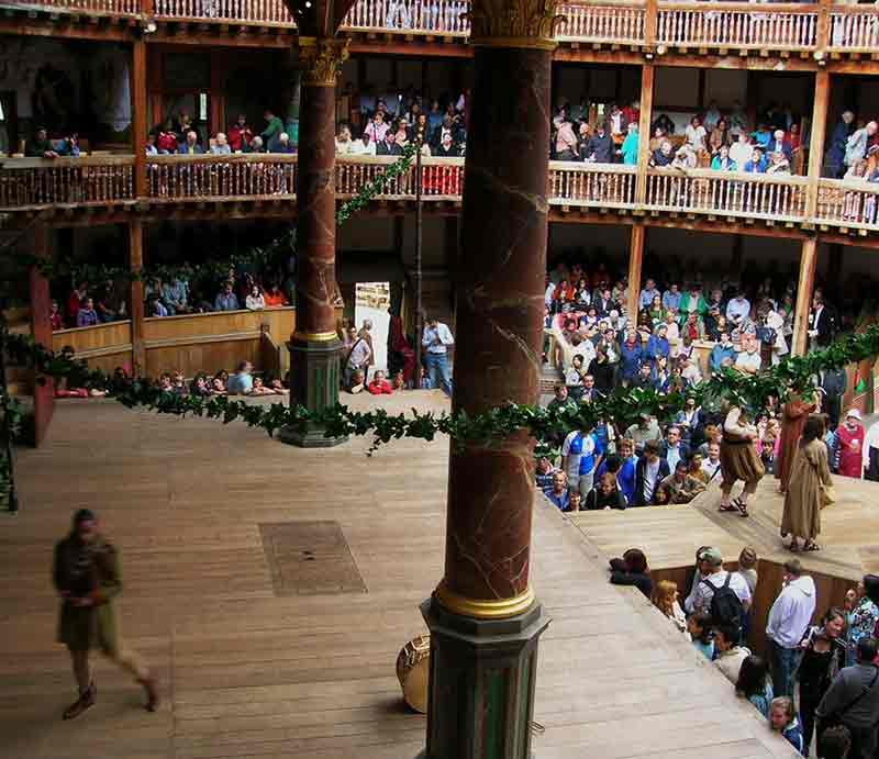 Stage with actors and audience.